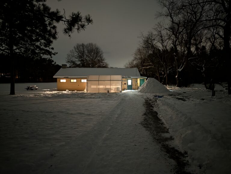 December 2025 Campout cabin at night with snow cave.